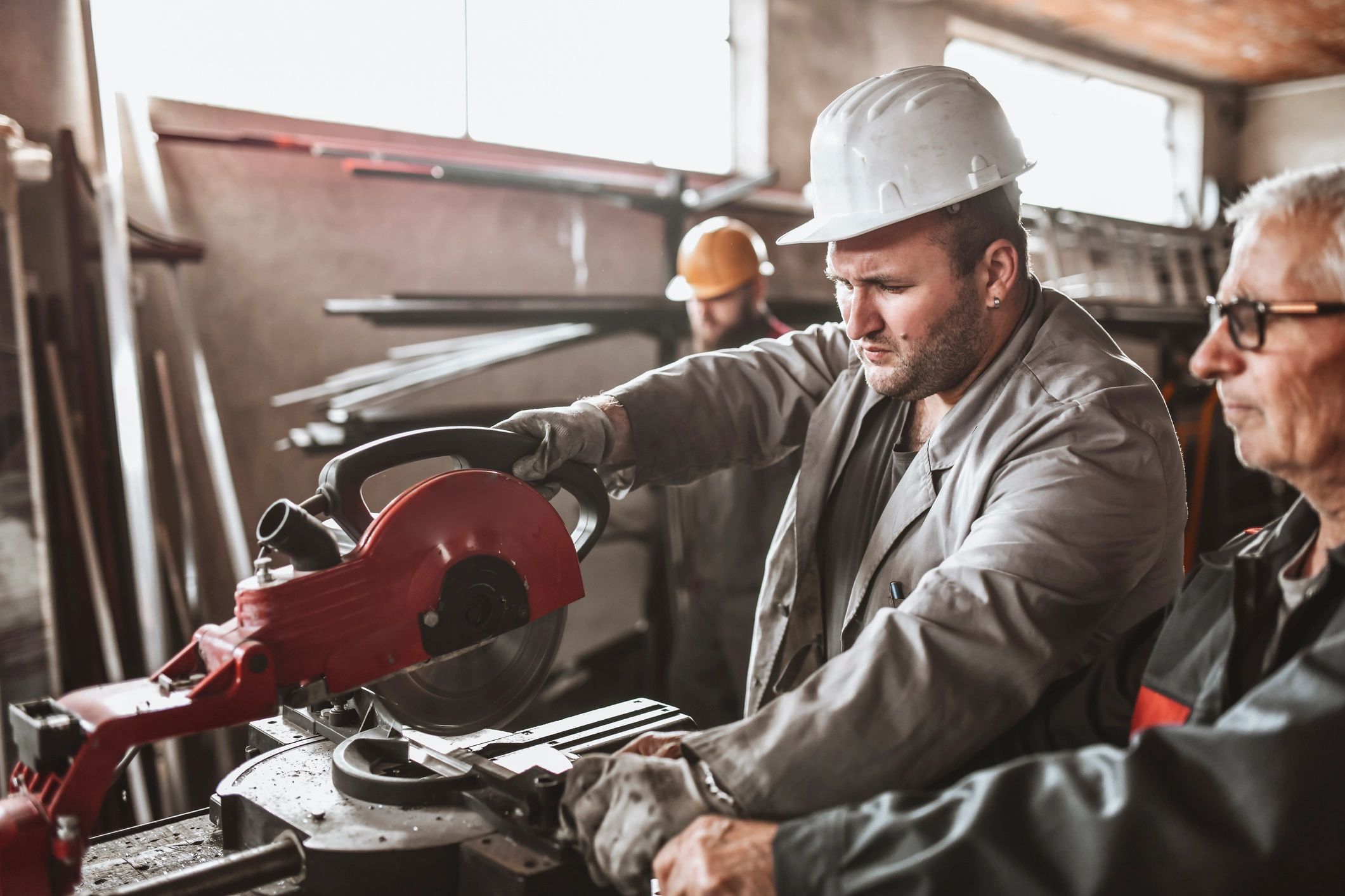 Workers cutting steel in a fabrication shop