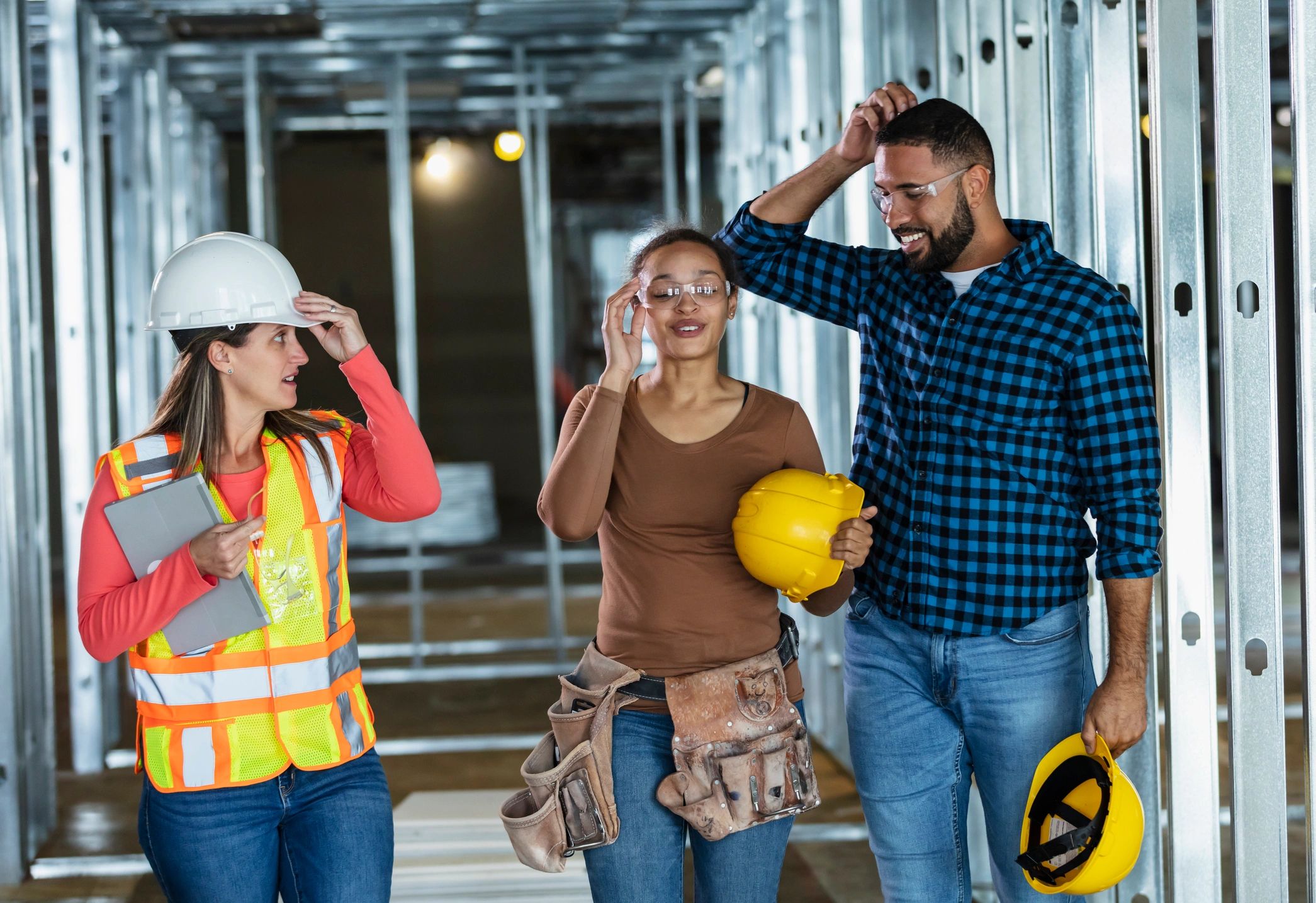 Construction team walking through a renovation site