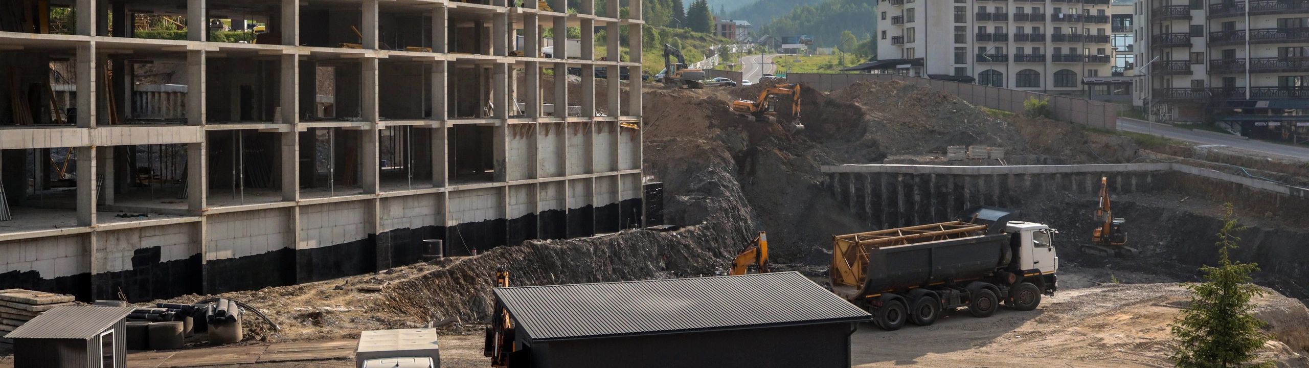 Construction site with steel structure and heavy machinery